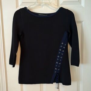 Spring weight sweater; size xs; black with dark blue trim & lace up detail.